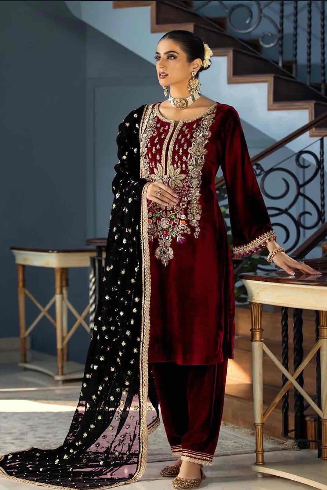 Model wearing Khuda Baksh Maroon Micro 5000 velvet 3-piece dress available on pakiclothing. Buy now!