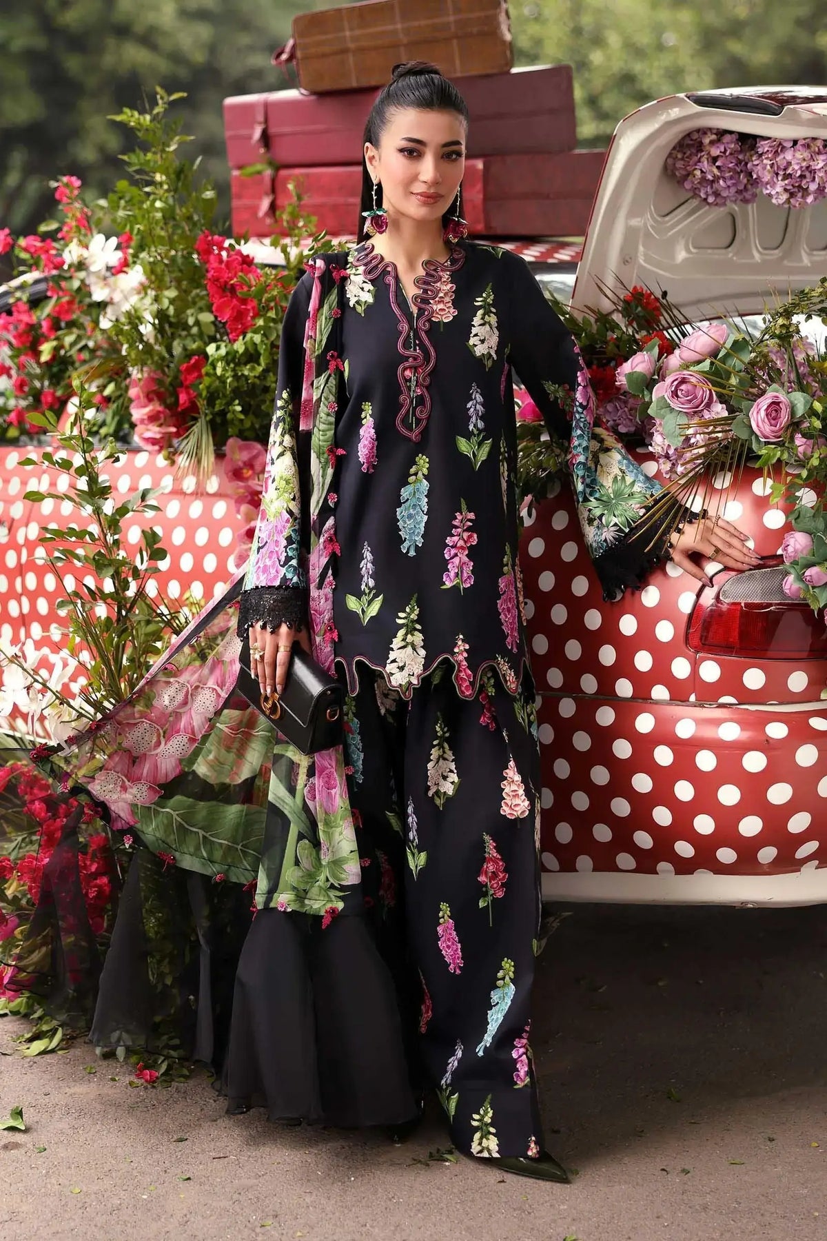 Model wearing Maria B Mprints 3Pcs embroidered lawn suit in Black by pkclothing.pk