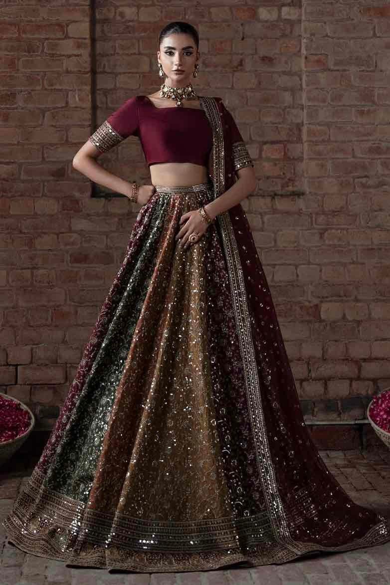 Front view of Mina Kashif Multi Raw Silk Lehanga set on pakiclothing featuring sequin embroidered multi-paneled skirt and maroon choli. Buy now!