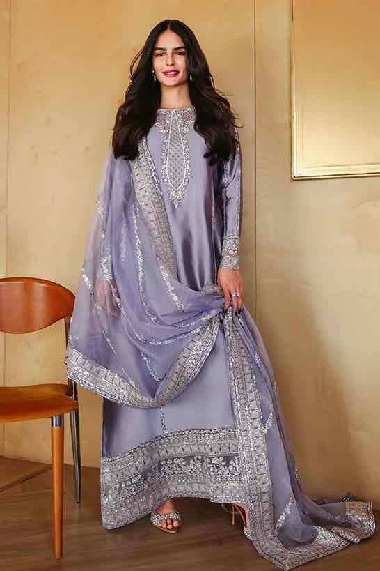 Full-length view of model wearing Mushq Lavender Embroidered Silk Dress with matching dupatta. Buy now!