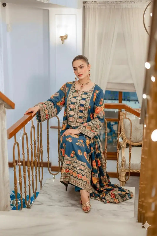 Woman in a patterned outfit standing on a staircase